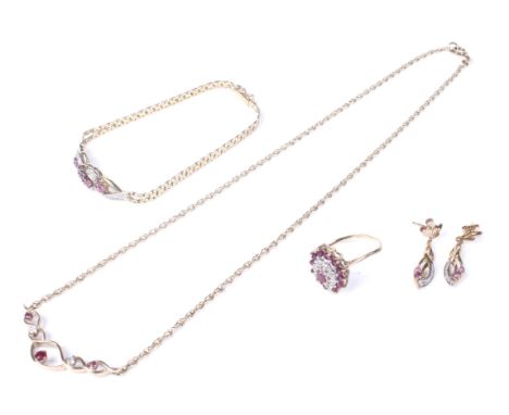 A group of vintage 9ct gold, ruby and diamond jewellery comprising a necklace, bracelet, ring and earrings. The necklace fron