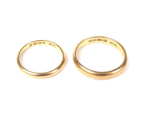 Two 22ct gold wedding bands. Comprising; a court shaped band with hallmarks for Birmingham 1924, 3.2mm wide, size N+, 4.5g; t