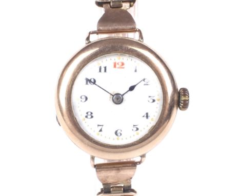 An early 20th century 9ct gold manual wind wristwatch. The circular enamel dial with Arabic numerals denoting hours, case bac