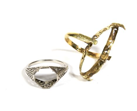 Two 20th century ring mounts. Comprising; an early 20th century platinum solitaire ring mount with a space for a hexagonal st