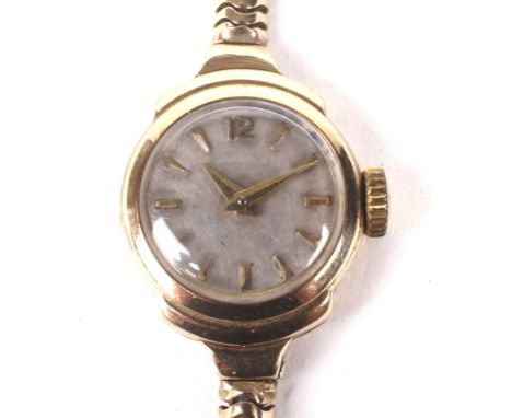 A mid century ladies 9ct gold cocktail wristwatch. The movement marked 'Zenith' 17 jewel manual wind, the circular dial with 