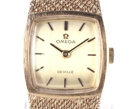 A ladies 9ct gold Omega De Ville wristwatch. The gilt dial with raised batons denoting hours, 17 jewel manual wind movement, 