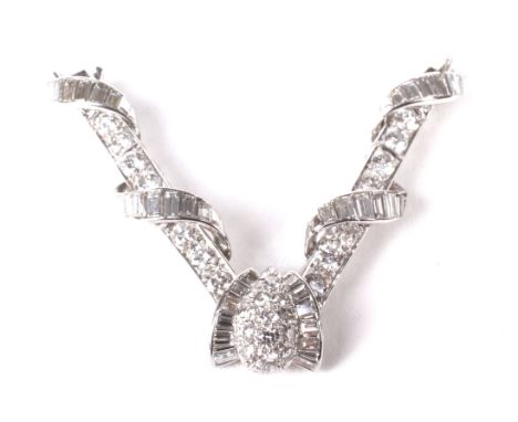 A vintage Chinese-export diamond necklace frontispiece. In the form of a central drop-shaped boss set with 12 small round bri