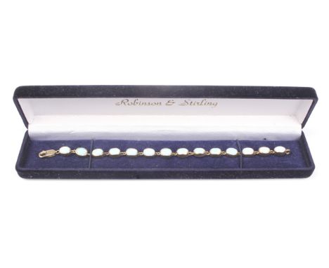 A synthetic white opal bracelet, the 14 oval cabochon stones each rub-over set, on a lobster-claw clasp stamped '375', 18.75c