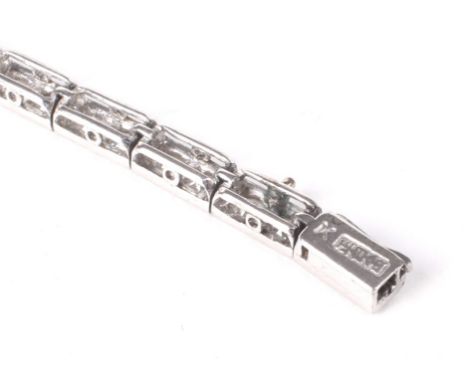 A vintage Chinese-export diamond line bracelet. In the form of 53 round brilliant diamonds approx. 3.18cts total, grain set i