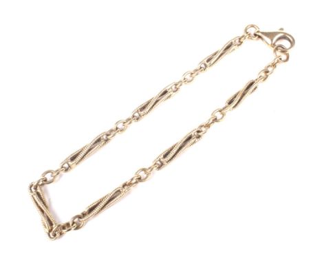 A Vintage yellow metal fancy rope-twist fetter link bracelet on a trigger clasp stamped '375'. approx. 18.5cm long, 7.2g.