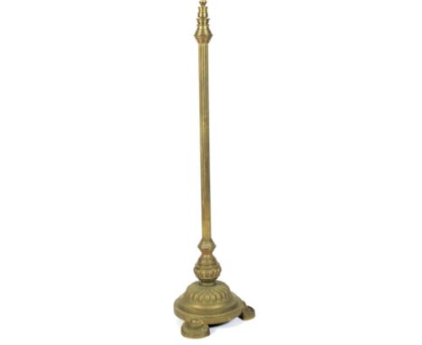 A 19th century Brass telescopic standard lamp. With Corinthian stem to a decorative base raised on shell feet. H132cm