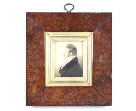 A framed Regency portrait miniature of a gentleman. Looking to the left, watercolour on vellum, in burr walnut frame, 8.5cm h