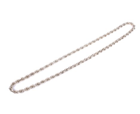 A vintage Continental yellow metal rope-twist continuous necklace. The rope-twist links approx 6.2mm diameter, approx. 58.5cm