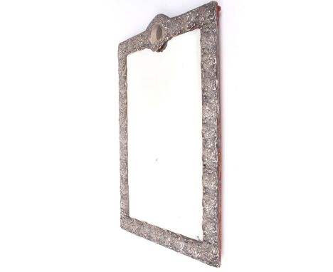 A large silver Victorian bevel edged easel tabletop mirror. Cast with rocaille scrolls and flowers centred with a shield shap