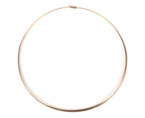 A modern 9ct gold necklace. In the form of semi-flexible oval section links on a push snap, post 2000 Edinburgh hallmarks, ma