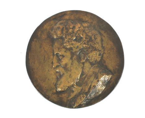 A 19th century patinated bronze portrait plaque. Cast with a portrait of a bearded man, to the left, incised WFW, 18.2cm diam