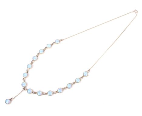 A vintage 9ct gold and synthetic-opal necklace. The front designed as a row of f14 round cabochon Gilson synthetic-black-opal