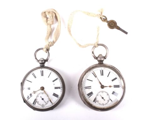 Two open faced silver pocket watches. Both having enamel dials with Roman numerals denoting hours, seconds subsidiary at the 