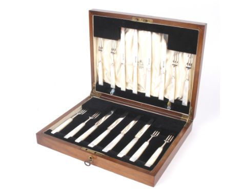 A cased eight setting silver and mother of pearl handled fruit knife and fork set. Sheffield 1931, maker CW Fletcher &amp; so