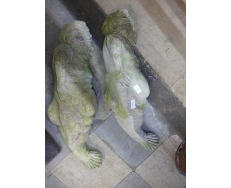 A pair of concrete architectural grotesque figures 