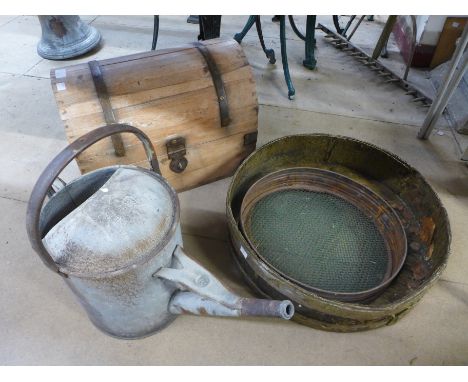A dome top trunk, galvanised watering can, two sieves, etc. 