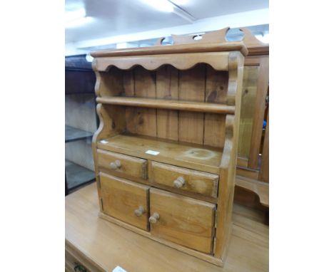 A small pine hanging wall cabinet 