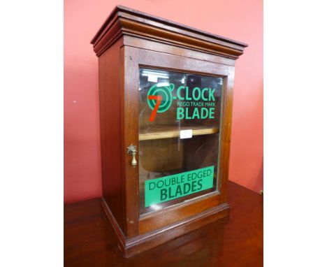 A mahogany table top shop cabinet bearing Clock Blade inscription 