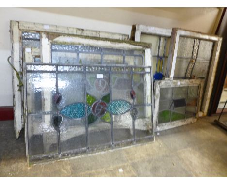Six stained glass windows and a stained glass panel 