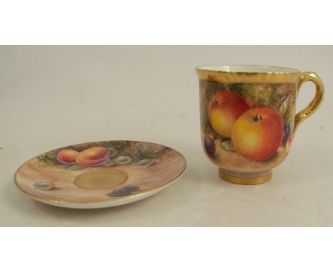 A Royal Worcester coffee cup, decorated with fruit to a mossy background by Freeman, together with a non-matching saucer, dec
