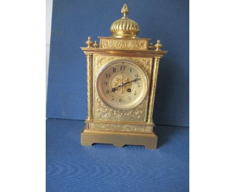 A French gilt metal striking mantle clock, retailed by Brundley's Ltd, Liverpool, the case moulded with foliage and four colu
