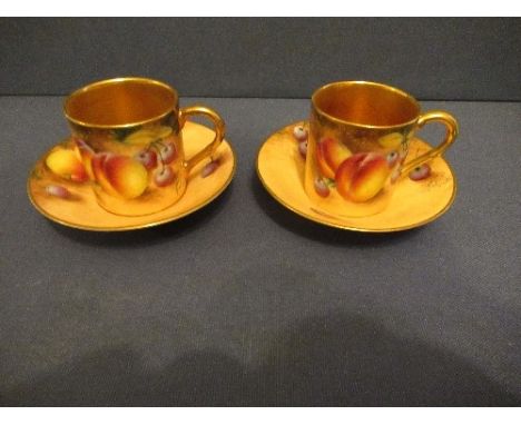 Two Royal Worcester coffee cans and saucers, decorated with hand painted fruit by RobertsCondition Report:  Both in good cond