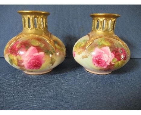 A pair of Royal Worcester quarter lobed vases, having pierced necks and decorated with roses, shape number 4306, circa 1915, 