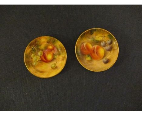 A Royal Worcester miniature plate by Freeman, together with a small dish, both decorated with hand painted fruit, diameter ap