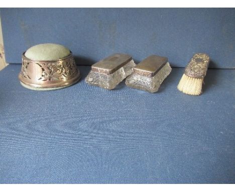 A hallmarked silver pin cushion, together with two silver top glass dressing table boxes, and a silver backed brush