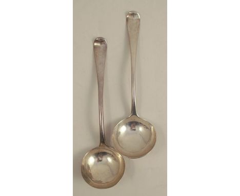 A pair of mid 18th century silver sauce ladles, engraved with a crest, bottom marked, London circa 1763, maker John Lampfert,