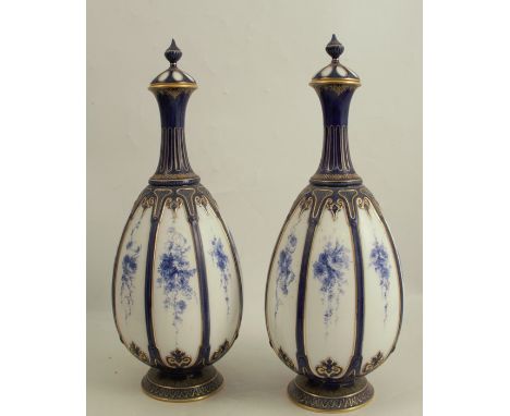 A pair of Royal Worcester covered vases, decorated with panels of blue flowers, shape number 1824, af, height 15insCondition 