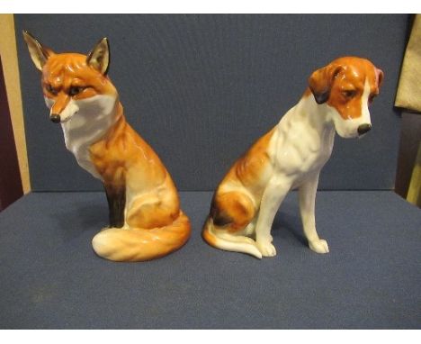 A Royal Worcester model of a seated fox, together with a seated hound, height approx 7.5insCondition Report:  Both in good co