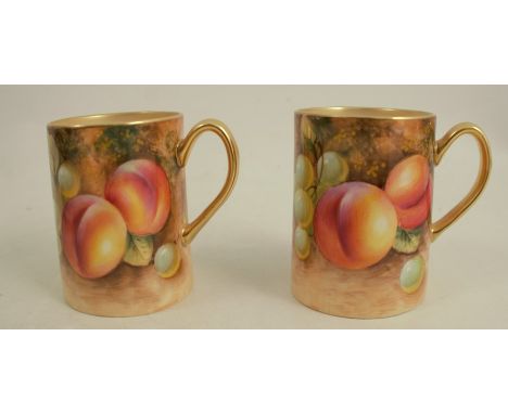 Two Royal Worcester tankards, decorated with hand painted fruit to a mossy background, one signed Roberts, height 2.75insCond