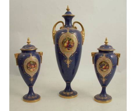 A Royal Worcester covered vase, with Sabrina ware ground decorated with a framed reserve of fruit to a mossy background by To