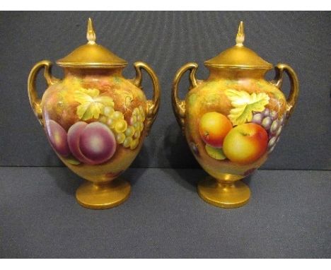 A pair of Royal Worcester covered vases, decorated with hand painted fruit by Leaman, shape 2701/1, height 7.5insCondition Re