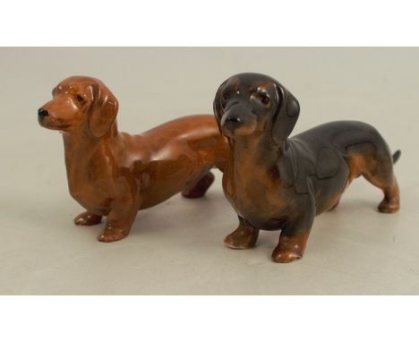 Two Royal Worcester models of Dachshunds, shape number 3294, length 4.5ins x height 2insCondition Report:  Darker model has a