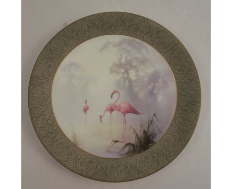 A Royal Worcester plate, decorated with a large central panel of flamingos by William Powell, to an en grisaille border, circ