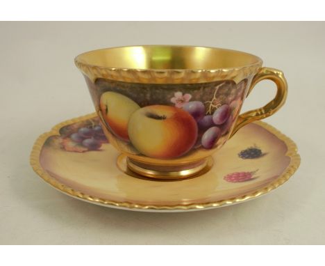 A Royal Worcester tea cup and saucer, decorated with hand painted fruit by P PlattCondition Report:  Good condition