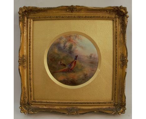 A Royal Worcester circular porcelain plaque, decorated with a cock and hen pheasant in landscape by Jas Stinton, dated 1930, 