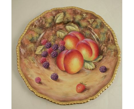 A Royal Worcester plate, decorated with hand painted fruit by Love, to a gadrooned border, diameter 10.5insCondition Report: 
