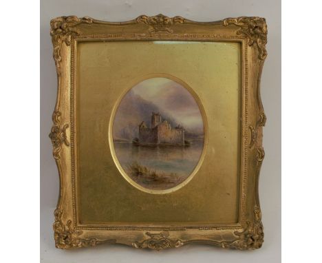 A Royal Worcester oval porcelain plaque, decorated with a view of Kilchurn Castle by J Stinton, signed twice, dated 1918, max