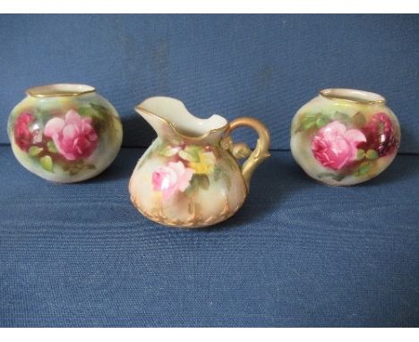 A matched pair of Royal Worcester wrythen moulded spherical vases, decorated with roses, shape G161, circa 1912, height 2.75i