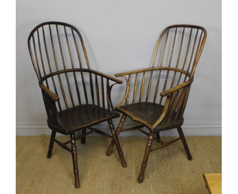 Two 18th Century elm two tier stick back Windsor armchairs of similar design, with shaped seats and bent strip arm support, o