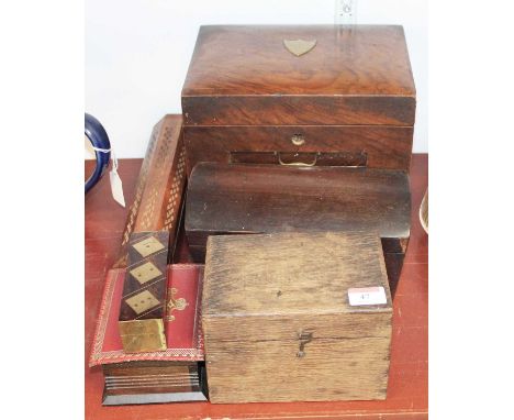A 1920s walnut work box, having a hinged lid opening to reveal partitioned interior, above a fallfront enclosing two drawers,