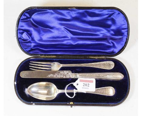A Victorian silver three piece christening set to include knife, fork and spoon, each with bright cut decoration and beaded r