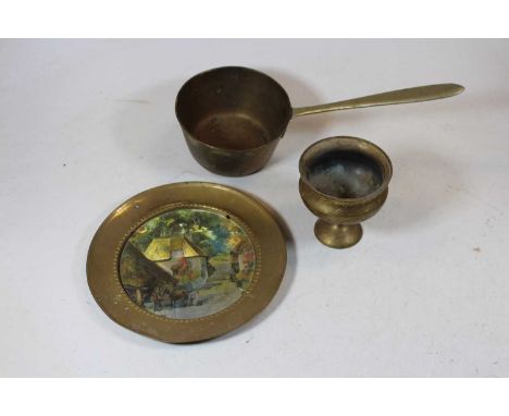 A collection of miscellaneous metalware to include brass trays, copper twin handled bowl, loose silver plated flatware, etc