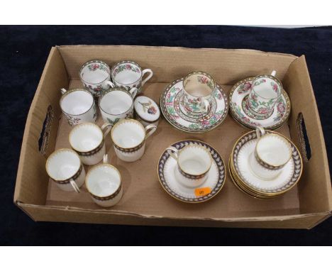 A set of six 19th century Wedgwood coffee cans, each on a white ground with blue banded floral decoration heightened in gilt;