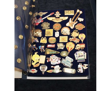 A large collection of enamelled and other badges, to include Walt Disney, Coca-Cola, Harley Davidson etc, contained in two ri