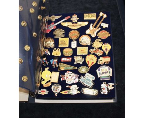 A large collection of enamelled and other badges, to include Walt Disney, Coca-Cola, Harley Davidson etc, contained in two ri